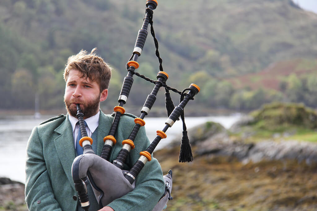 Man playing bag pipes